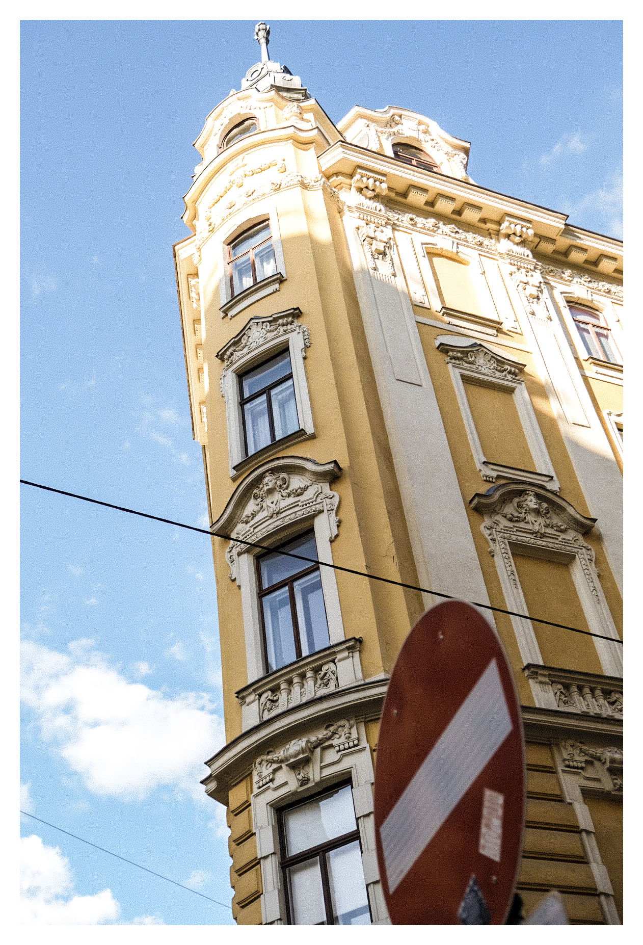 Sunny building facade photographed from below